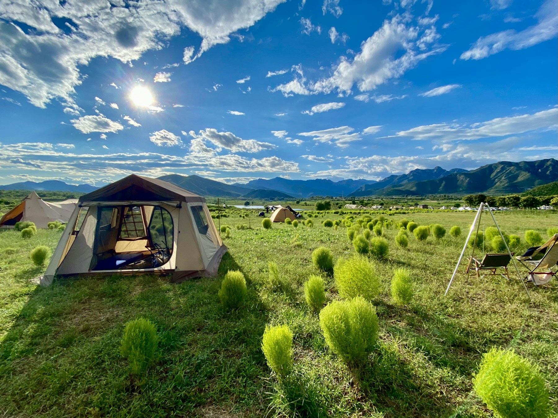A real campground with tents in a mountain landscape